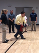 Volunteers practicing with a fire extinguisher's