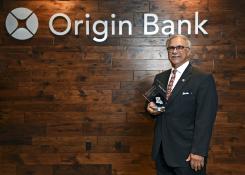 Origin Bank accepting award