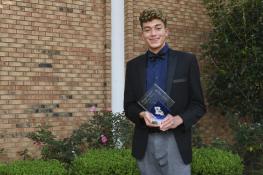 Ethan-Jeffus holding award