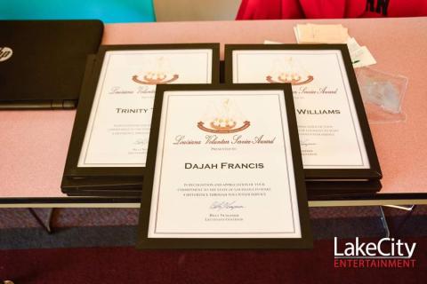 3 Louisiana Volunteer Services awards on a table