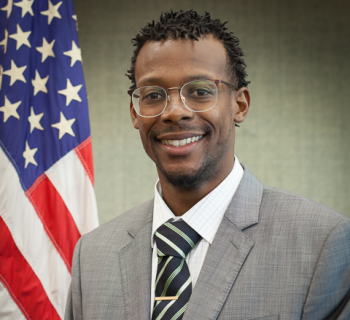 DeRon Talley in front of the us flag