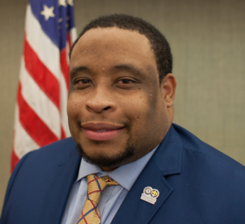 Gerren Sias in front of the us flag