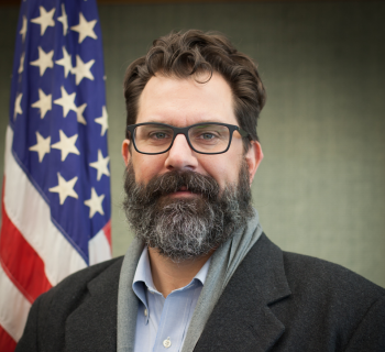 Kyle Wedberg in front of the us flag