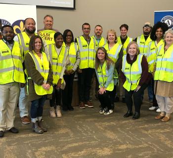 ULM Campus CERT Team standing in front of a wall