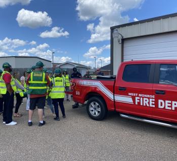 West Monroe CERT Team standing behind a fire truck